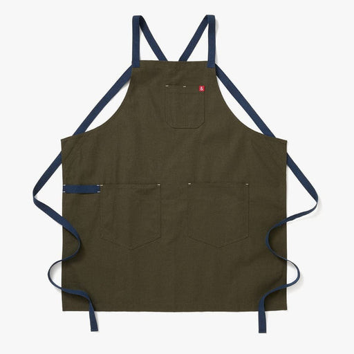 Hedley & Bennett | All Day Crossback - Olive apron features durable canvas with two large front pockets, a chest pocket, and navy-blue crossback straps.