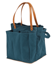 CapaBunga Market Tote features sturdy design with brown handles, compartments for fragile items, and external cinching straps, ideal for market or outdoor use.