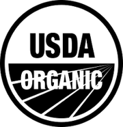 Georgia Grinders Organic Crunchy Peanut Butter logo, featuring black and white design elements, representing premium quality and local sourcing from Georgia.