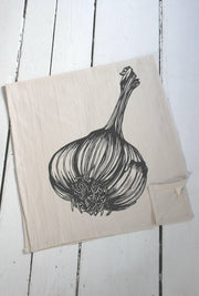 Hearth and Harrow Organic Cotton Garlic Tea Towel featuring a hand-printed garlic design on a large, eco-friendly cotton towel, ideal for stylish kitchen use.
