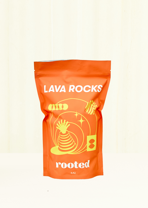 Rooted | Organic Potting Mix - Volcanic Lava Rocks: Bright pouch for gardening, featuring a spiral graphic, ideal for tropical plants, cacti, and succulents.