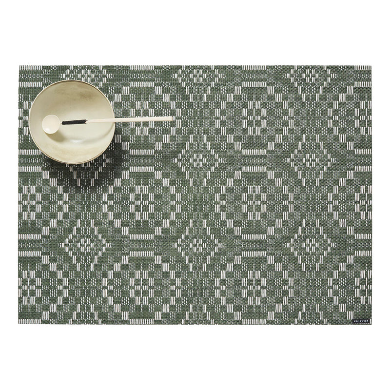 Chilewich | Overshot Rectangular Placemat, Thyme, features a geometric pattern; pictured with a bowl and spoon, highlighting its elegance for sophisticated dining settings.