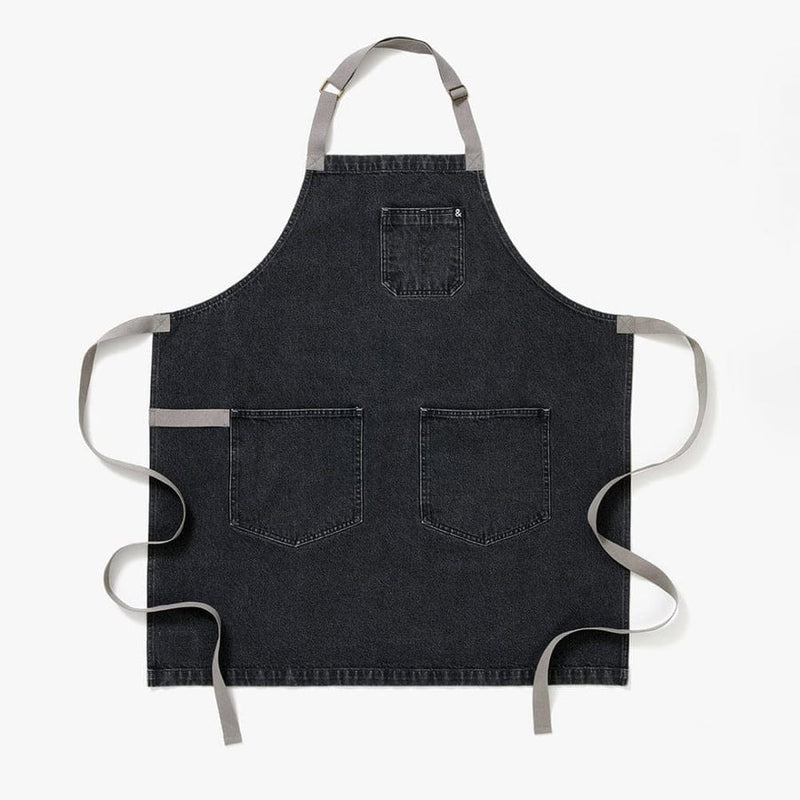 Hedley & Bennett | Essential - Oyster Gray Denim apron with a chest pocket, two lower front pockets, and contrasting gray straps, ideal for culinary enthusiasts.