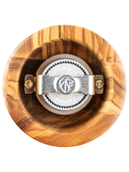 Top view of Peugeot Paris Classic Olive Pepper Mill, 9 inches, showcasing its central metal burr assembly inside the hollow olive wood body.