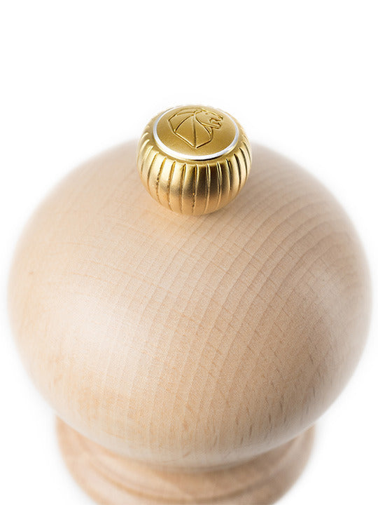 Peugeot | Paris Classic Salt Mill, Natural Wood, 9 inches, featuring a smooth, rounded wooden head and a golden adjustment knob for customizable grinding.