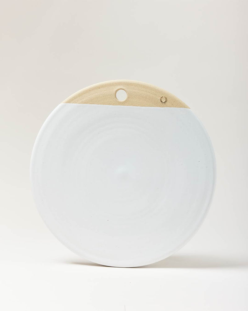 Farmhouse Pottery Cheese Stone, 14-inch handcrafted ceramic disk with smooth white glaze and natural clay top, featuring a hole for wall display.