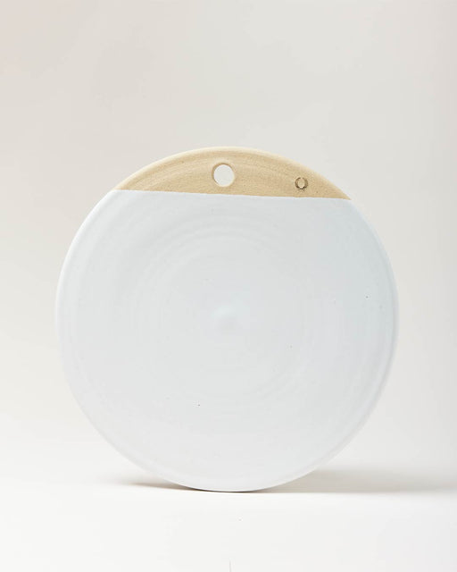 Farmhouse Pottery Cheese Stone, 14-inch handcrafted ceramic disk with smooth white glaze and natural clay top, featuring a hole for wall display.