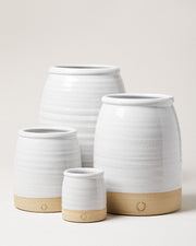 Farmhouse Pottery | Beehive Crock - Large: A set of four ceramic pots with ribbed white glaze and natural clay base, featuring a stamped wreath motif.