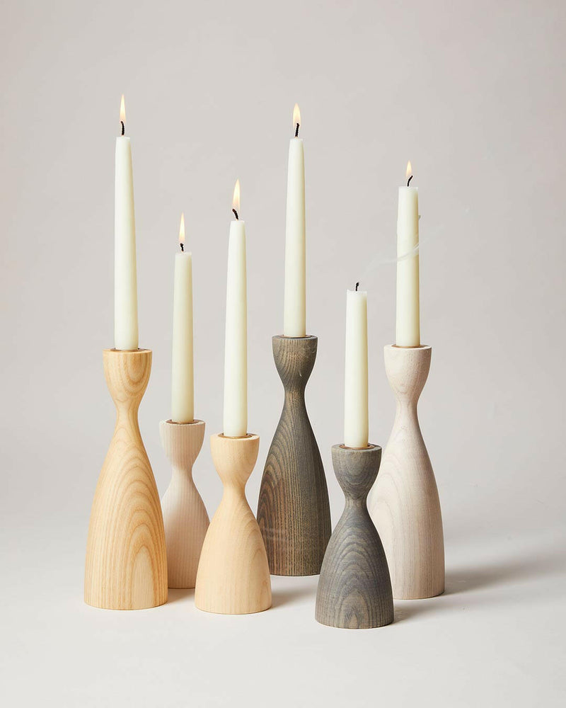 Farmhouse Pottery's medium natural candlesticks, crafted from American ash with a brass insert, epitomize modern elegance, perfect for enhancing any table setting.