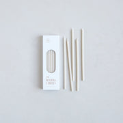 The Floral Society | Wishing Candles, Miel, featuring a box of 24 ivory taper candles, perfect for adding elegance to any occasion or daily ritual.