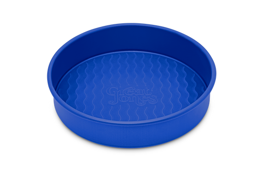 Great Jones | Patty Cake - Broccoli, showcasing its wavy, corrugated stainless-steel design, ideal for effortless baking and easy release of goods.