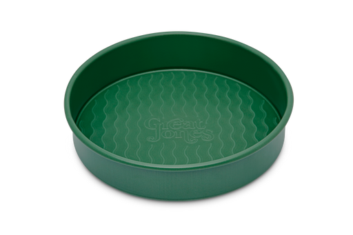 Great Jones | Patty Cake - Broccoli features a wavy, corrugated bottom for easy release, with a durable stainless-steel design ideal for even, golden baking results.