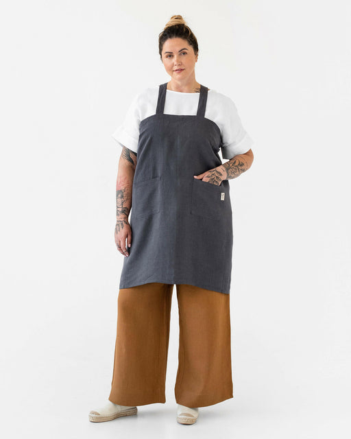 MagicLinen Pinafore Cross-Back Linen Apron in Dusty Blue, L-XL, featuring criss-cross straps and side pockets, ideal for cooking or gardening.