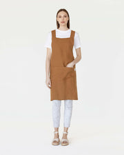 MagicLinen Pinafore Cross-Back Linen Apron in Dusty Blue, featuring criss-cross straps and side pockets, ideal for cooking or gardening enthusiasts.
