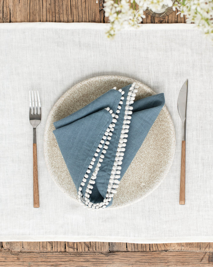 MagicLinen Pom Pom Trim Linen Napkins in Gray Blue, set of 2, featuring elegant design for versatile dining use, perfect for enhancing any tablescape.