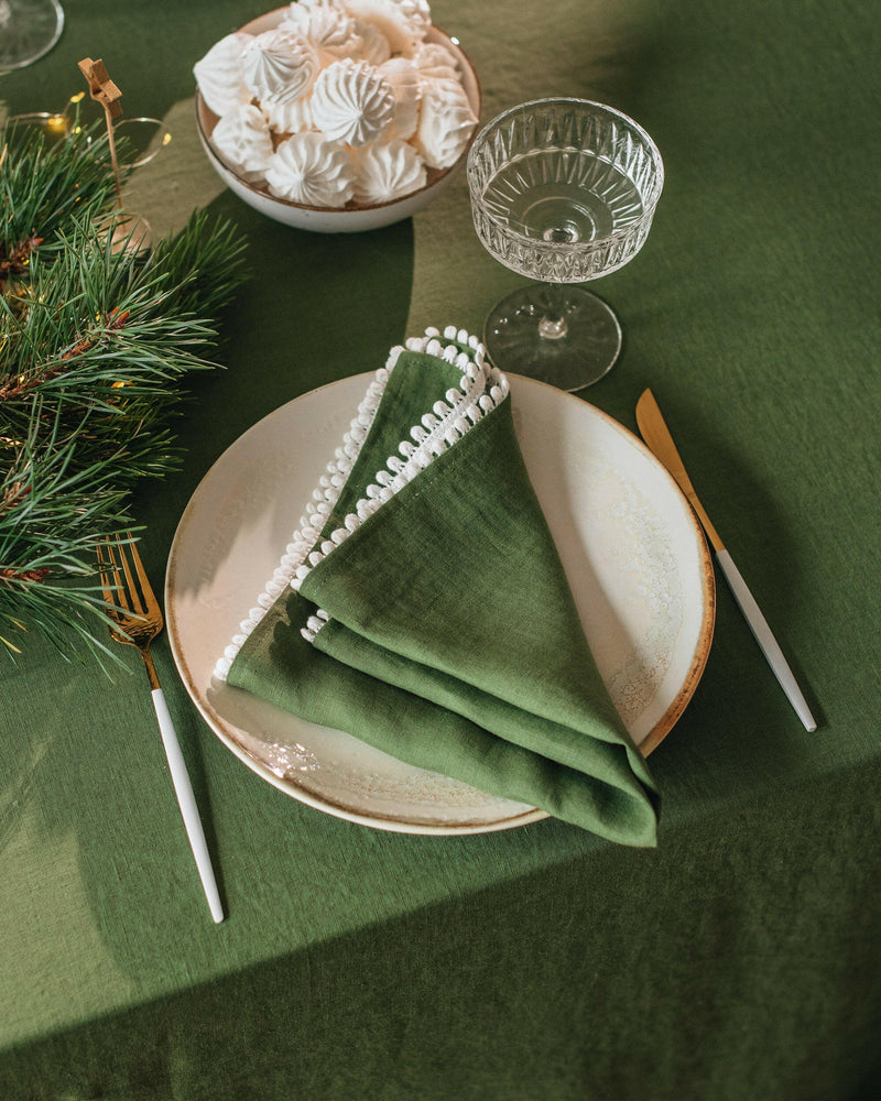 MagicLinen Pom Pom Trim Linen Napkins in Gray Blue, set of 2, featuring elegant white pom pom trim, perfect for versatile, stylish dining settings.