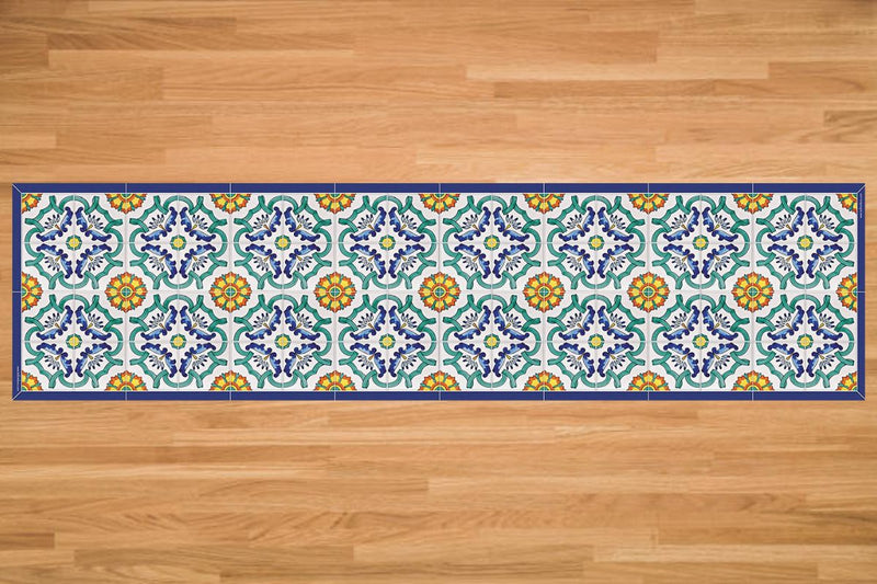 Etú HOME | Positano B Italian Vinyl Rug on wood floor, showcasing intricate blue, green, yellow, and white patterns, ideal for kitchens and entryways.