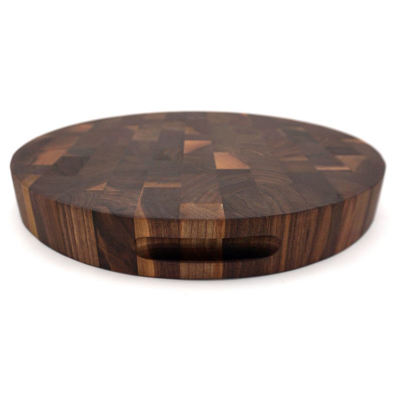 Round walnut cutting board, 16 inches, from J.K. Adams' Professional End Grain Boards, ideal for kitchen tasks.