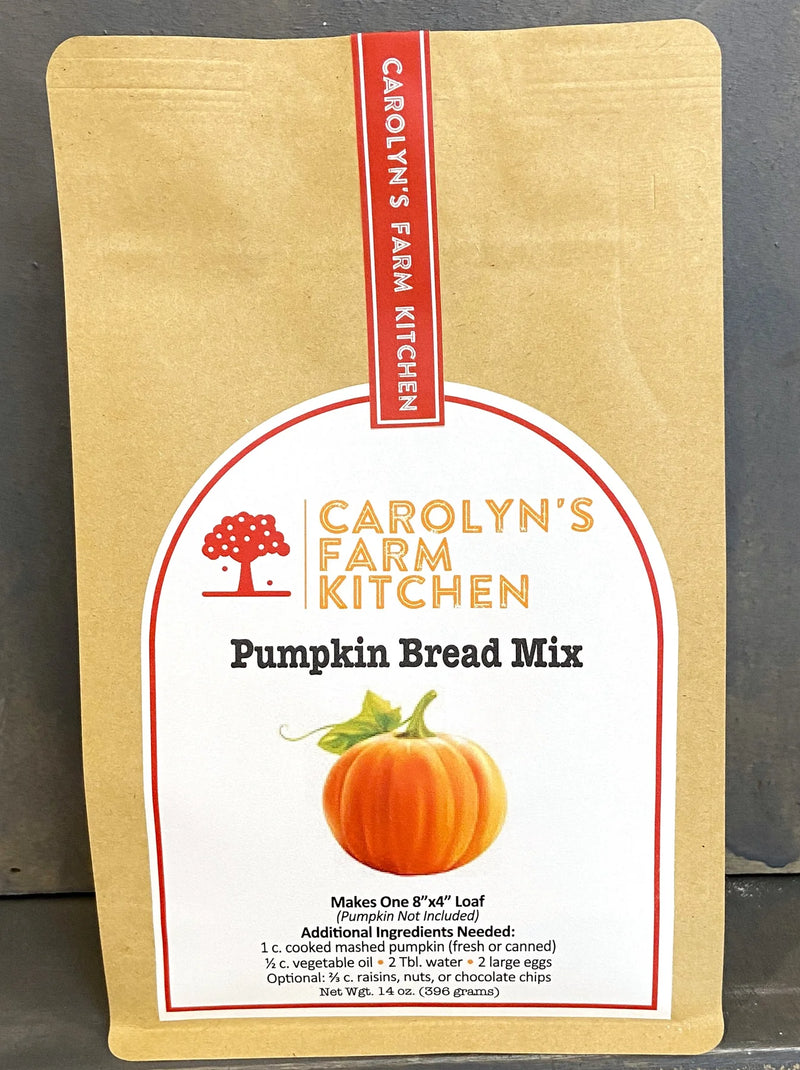 Carolyn's Farm Kitchen Pumpkin Bread Mix in kraft pouch, featuring a pumpkin illustration; makes one 8x4 loaf with added pumpkin, oil, water, and eggs.