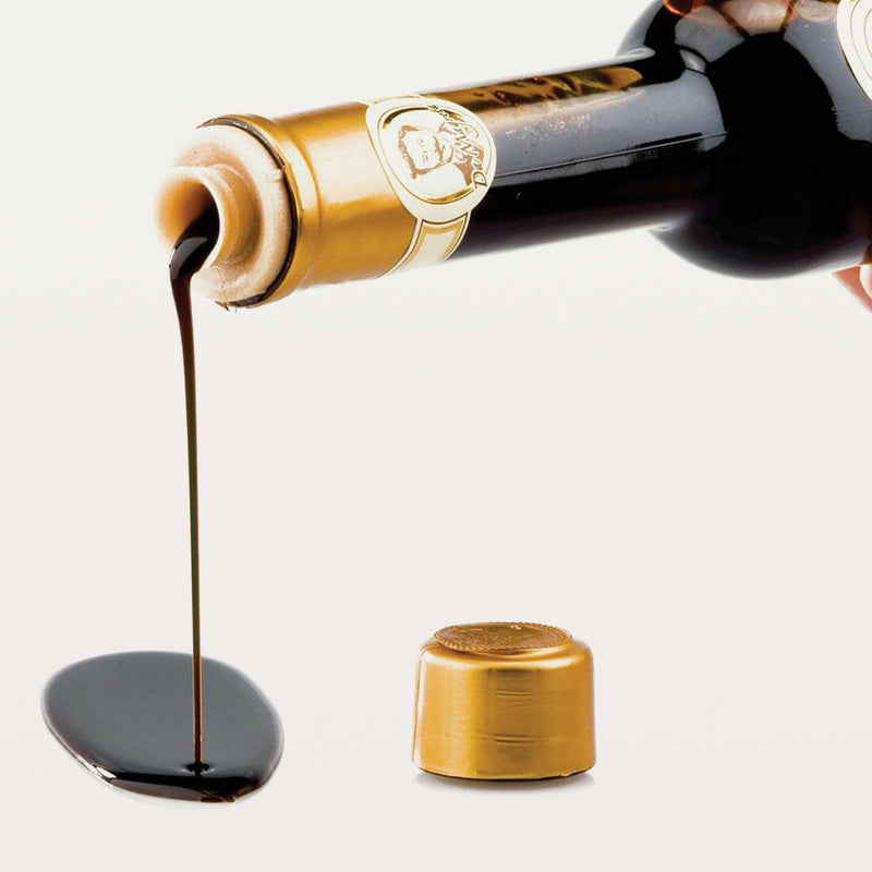 Acetaia Leonardi | 16 Year Balsamic Vinegar pouring from a bottle, showcasing its rich texture and heritage craftsmanship by the Leonardi family.