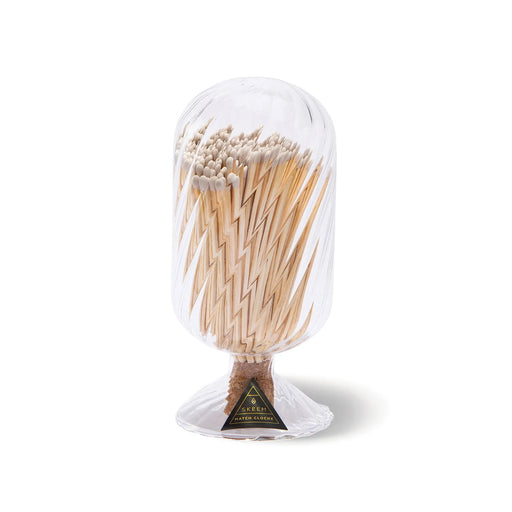 Skeem | White Helix Match Cloche: A clear glass dome filled with white-tipped matches, featuring a cork base striker and SKEEM Match Cloche label.