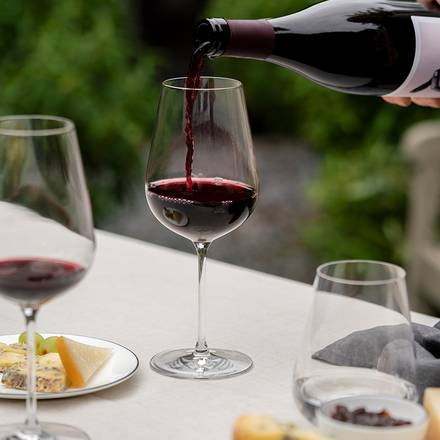 Richard Brendon | Jancis Robinson Precision Wine Glass Set of 4, shown with red wine being poured, highlighting the elegance of the stemware.