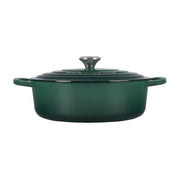 Le Creuset Signature Round Wide Oven - Olive: 6.75-quart forest-green enameled cast-iron Dutch oven with lid and handles, ideal for casseroles and slow-cooked meals.