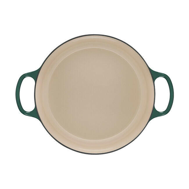 Le Creuset Signature Round Wide Oven in Olive, showcasing its wide, shallow design with light cream interior, ideal for versatile cooking and serving.