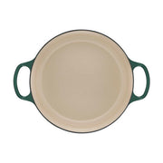 Le Creuset Signature Round Wide Oven in Meringue, a 6.75-quart enameled-cast-iron pot with side handles, perfect for even cooking and stylish table presentation.