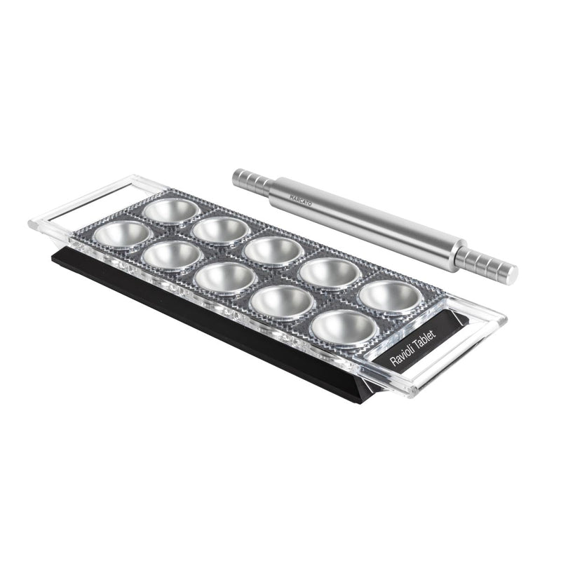 Close-up of Marcato Ravioli Tablet, showcasing its metal tool design for forming, cutting, and sealing ravioli with a non-skid base.