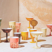 Sir|Madam Rialto glassware collection lifestyle shot with Ox Blood coupe on a marble backdrop