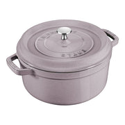 STAUB Cocotte 5.5 qt Lilac, perfect for slow-cooking, features a self-basting lid and enamel finish, ideal for both kitchen use and elegant serving.