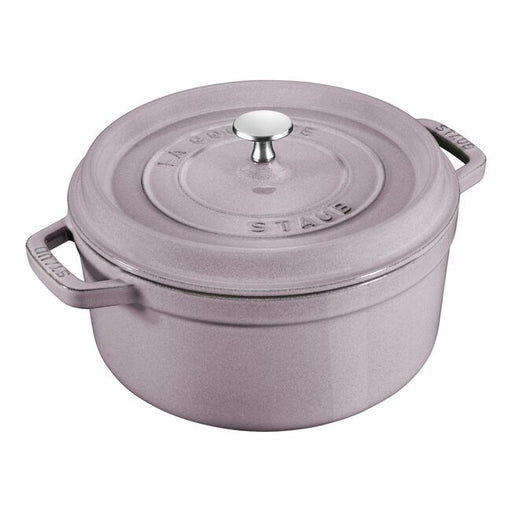 STAUB Cocotte 5.5 qt Lilac, perfect for slow-cooking, features a self-basting lid and enamel finish, ideal for both kitchen use and elegant serving.