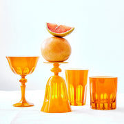 Sir|Madam Rialto Saffron glassware styled with fresh grapefruit — coupe, tulip, and tumblers together