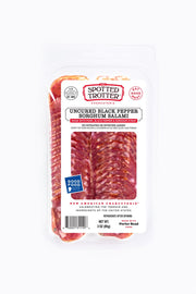 Spotted Trotter | Salamis - Black Pepper Sorghum, artisanal salami with visible marbling and spices, crafted from high-quality pork, embodying traditional Spanish flavors.
