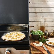 de Buyer | Blue Steel Pizza Tray - 16 in, featuring a perforated design for crispy crusts, ideal for baking pizzas and tarts with professional-quality results.