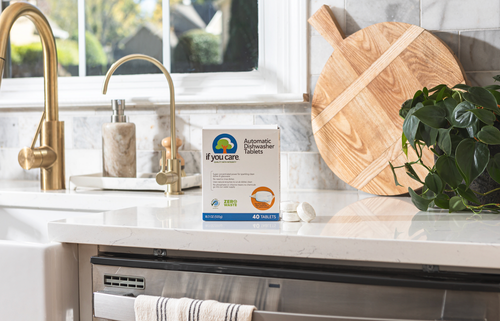 If You Care Automatic Dishwasher Tablets on a kitchen counter, next to a sink and soap dispenser, highlighting eco-friendly cleaning power.