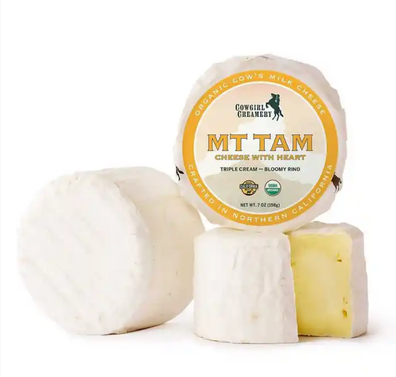Cowgirl Creamery | Mt. Tam cheese with creamy interior and bloomy rind, showcasing its rich texture and complex, mushroomy flavors.