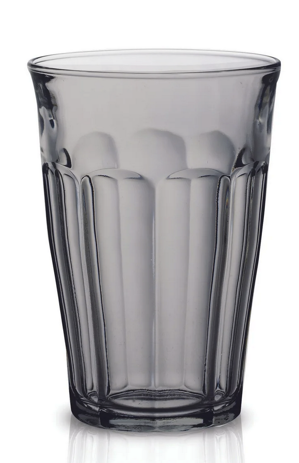 Duralex | Picardie Tumbler set of 6 features a fluted design, perfect for enhancing any kitchenware collection. The glass is showcased upright on a reflective surface.