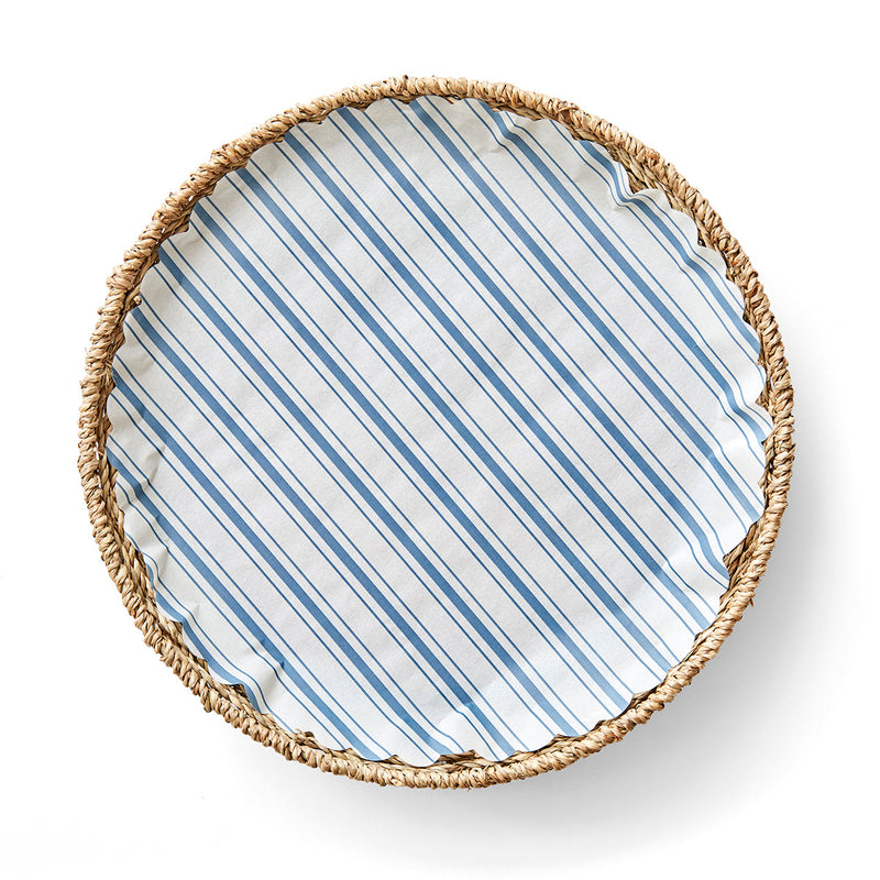 Seascape Blue Original Flat Plate Liners in an oval basket with a blue and white striped pattern, ideal for enhancing table settings from Athens Cooks.