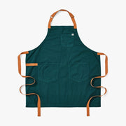 Hedley & Bennett Essential Garment Dyed - Seaweed Green apron, featuring a dark teal design with tan straps, one chest pocket, and two front pockets, ideal for kitchen use.