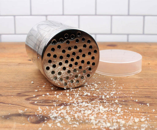 Shaker - Fine Mesh on table, featuring a compact design with a perforated lid, ideal for dispensing spices or powdered sugar. Perfect for small kitchens.