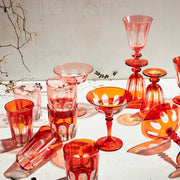 Sir|Madam | Rialto Old Fashion Light Red Set of 2, showcasing artisan-crafted, uniquely colored glassware inspired by Venice's arches, displayed with berry-accented branches.