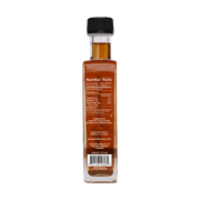 Runamok Maple Syrups - Smoked with Pecan Wood bottle, showcasing nutrition label; perfect for enhancing waffles, coffee, or ice cream with rich, smoky maple flavors.