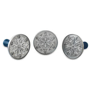 Nordic Ware Snowflake Cookie Stamps set of 3, featuring cast aluminum with wooden handles, designed to emboss snowflake patterns on cookies effortlessly for festive baking.