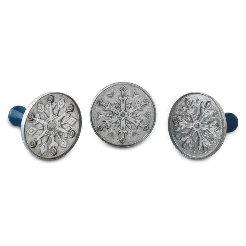 Nordic Ware Snowflake Cookie Stamps set of 3, featuring cast aluminum with wooden handles, designed to emboss snowflake patterns on cookies effortlessly for festive baking.