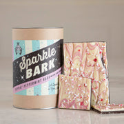 Hester & Cook | Sparkle Bark - 8 oz. features dark and pink-swirled chocolate peppermint bark, topped with crushed candy cane pieces, highlighting its artisanal, all-natural ingredients.
