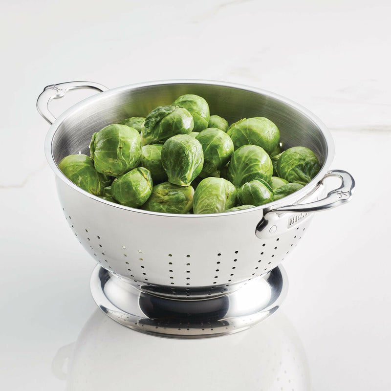 Hestan Provisions | Stainless Steel Colanders - 3 Quart filled with fresh Brussels sprouts, showcasing its capacity and sturdy design for efficient kitchen use.