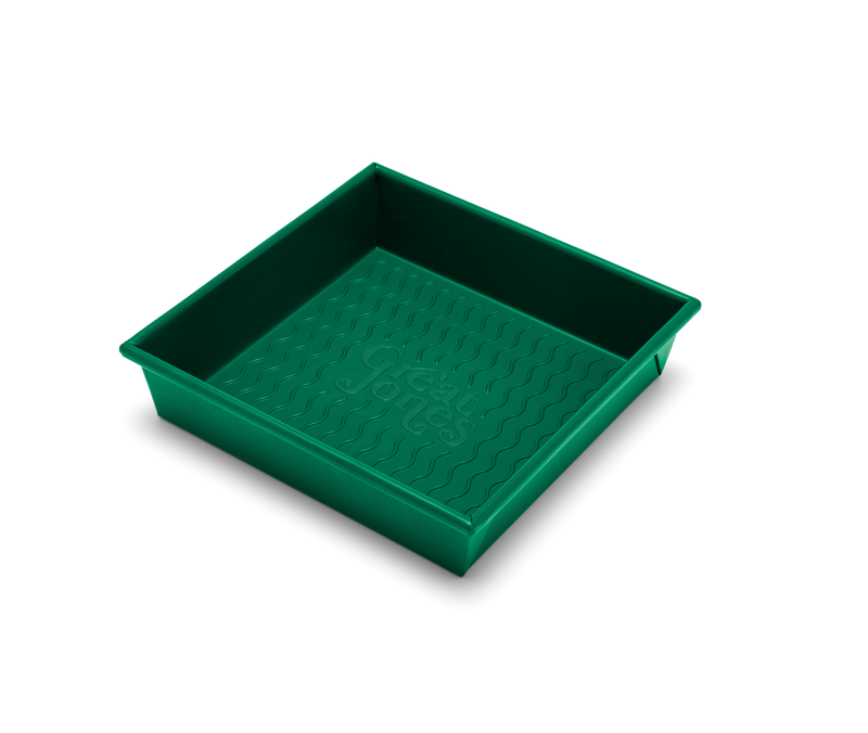 Great Jones | Square One - Broccoli: A 9x9-inch square baking pan with a wavy, corrugated bottom for easy release, nonstick and nontoxic, ideal for even baking.