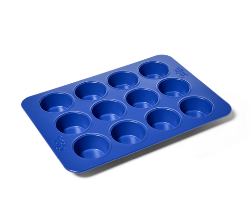 Great Jones | Stud Muffin - Blueberry pan with 12 nonstick, nontoxic cavities, ideal for muffins or cupcakes, ensures even heat distribution and easy cleanup.